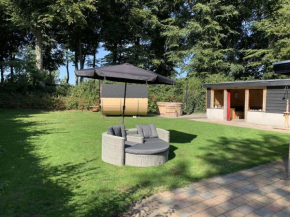 Holiday home with covered porch and sauna